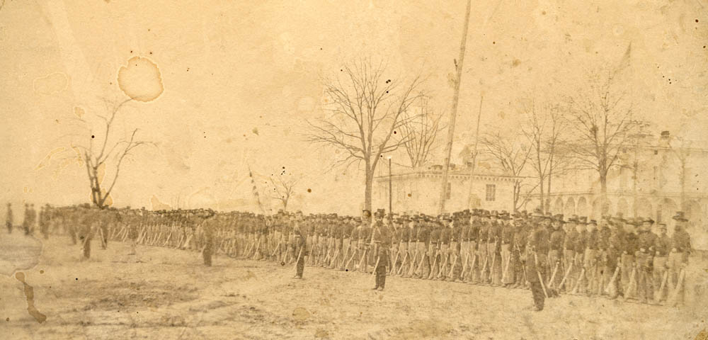 A picture of the 2nd Wisconsin Cavalry standing outside of Benton Barracks in St. Louis, Missouri.