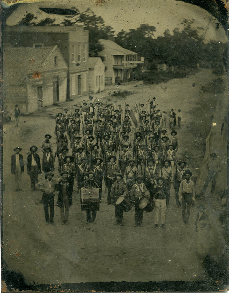 Company B, 3rd Akransas State Troops standing in a street.