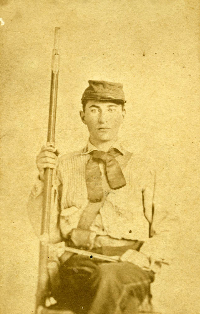 James Flynt in uniform with rifle.
