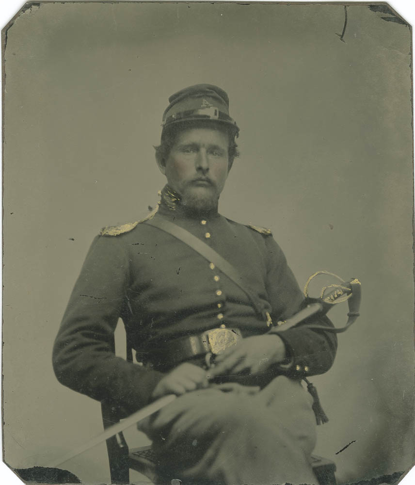 Benjamin Fullager sitting with sword.