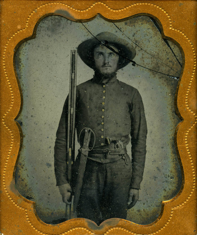 William Hogsett in uniform with rifle.