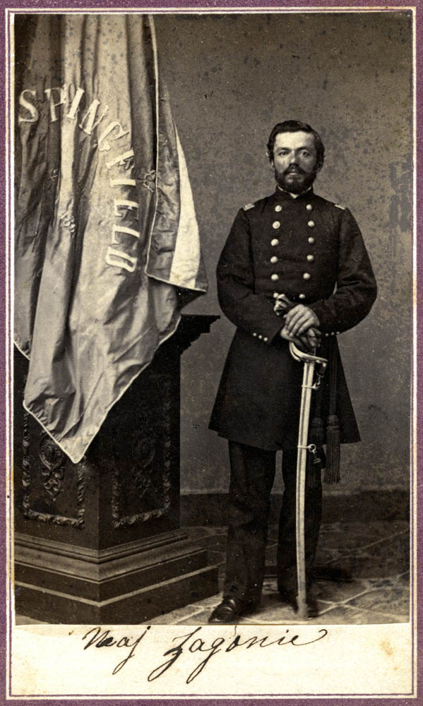 Charles Zagonyi leaning on sword next to a pedestal with a Springfield, Mo. flag.