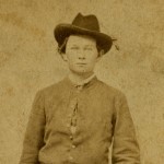 William Sargeant standing near chair.